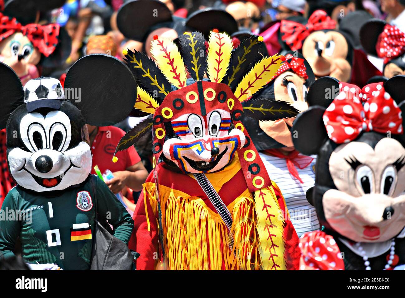 Local people with colorful masks and costumes participating at the parade of Día de los locos in San Miguel de Allende, Guanajuato Mexico. Stock Photo