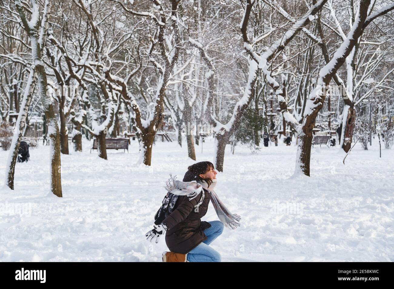 Woman in Winter Clothes on a Walk in the Park. There is a Lot of Snow  Around Stock Photo - Image of walk, forest: 207578936