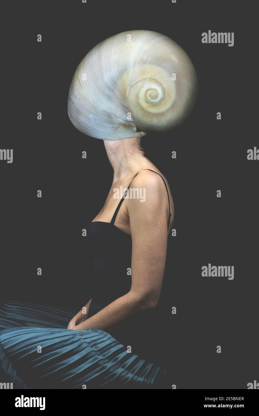 surreal woman with a shell that wraps her face Stock Photo
