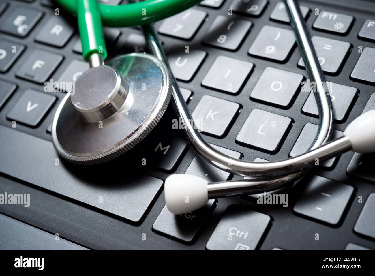 Stethoscope on the keyboard of a laptop Stock Photo - Alamy