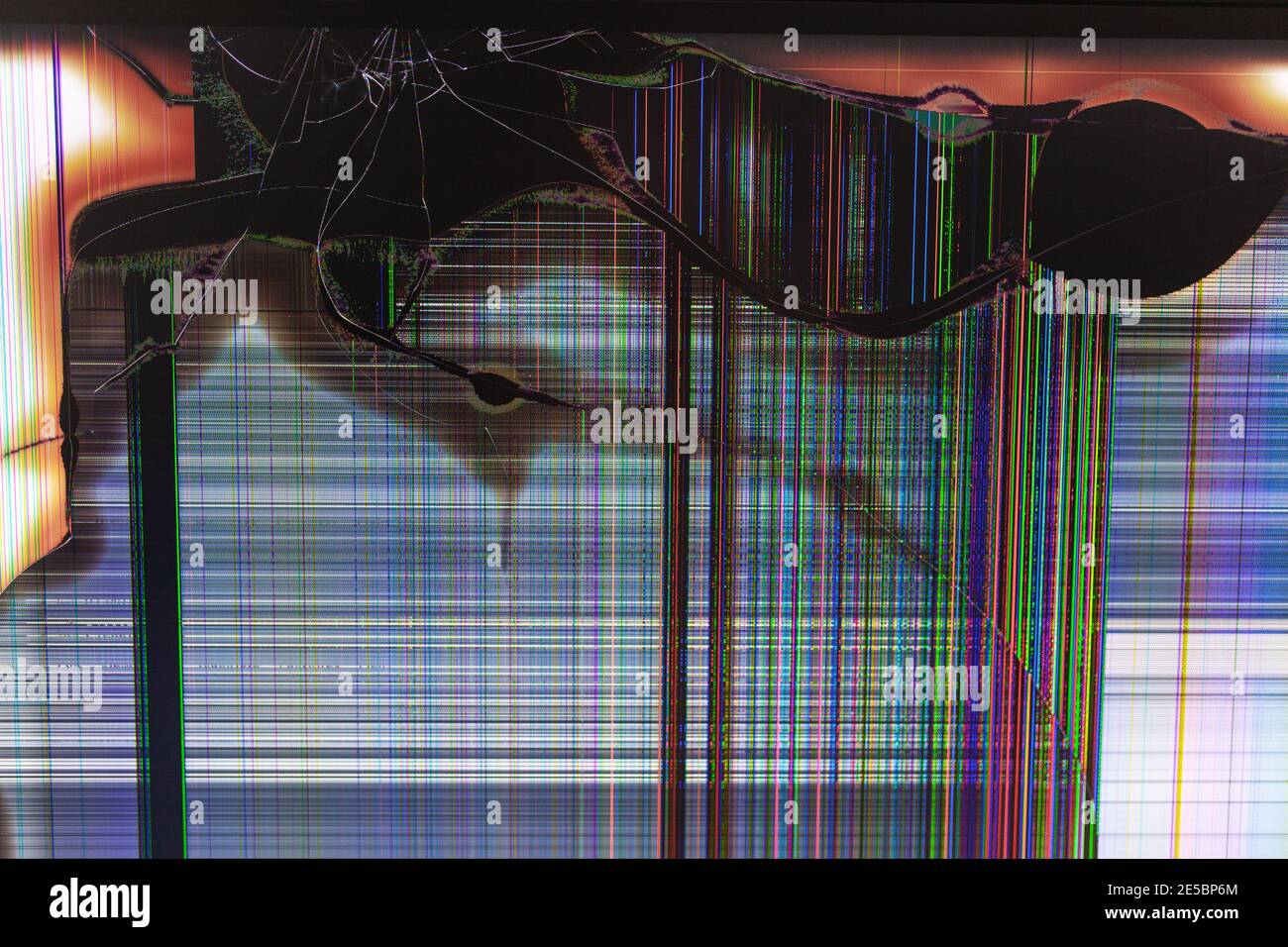 Black screen crack with colorful lines running across the broken monitor Stock Photo