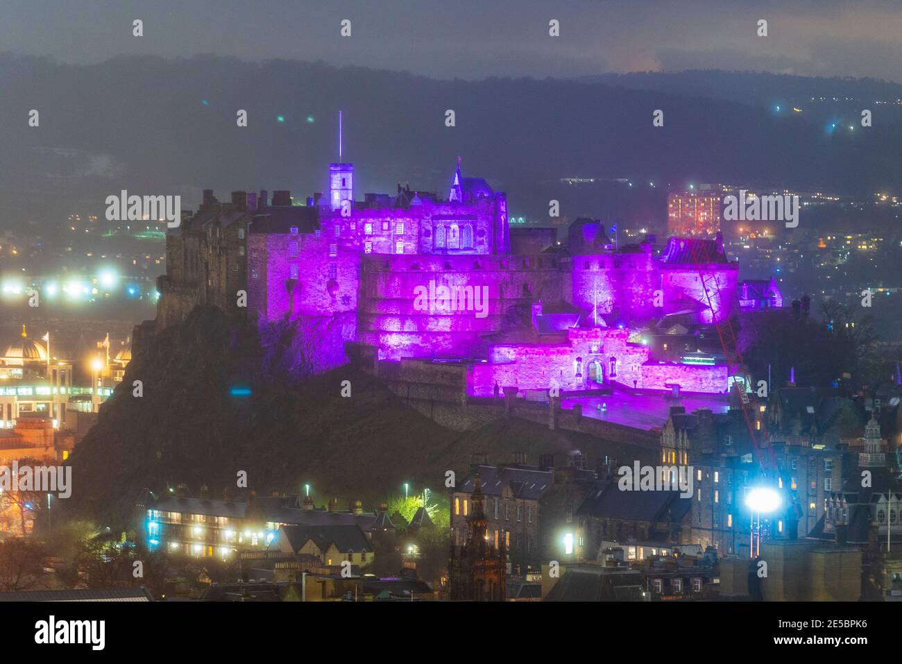 Edinburgh, Scotland, UK. 27 January 2021.  Edinburgh Castle is illuminated in purple tonight light as the world marks Holocaust Memorial Day ( HMD). Iain Masterton/Alamy Live News Stock Photo