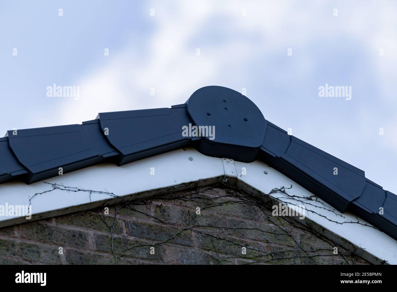 A dry verge system on the roof of a house. Stock Photo
