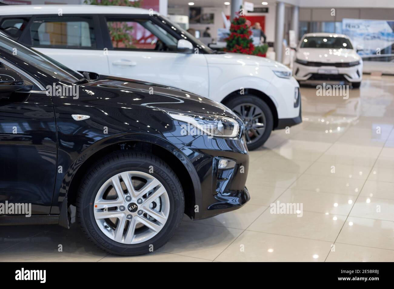 Russia, Izhevsk - December 28, 2020: KIA showroom. New modern cars in dealer showroom. Famous world brand. Prestigious vehicles. Stock Photo