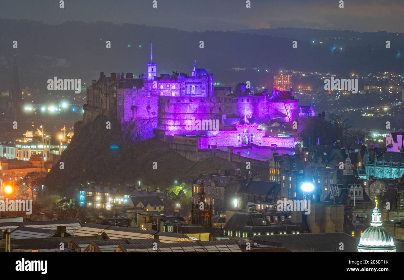 Edinburgh, Scotland, UK. 27 January 2021.  Edinburgh Castle is illuminated in purple tonight light as the world marks Holocaust Memorial Day ( HMD). Iain Masterton/Alamy Live News Stock Photo