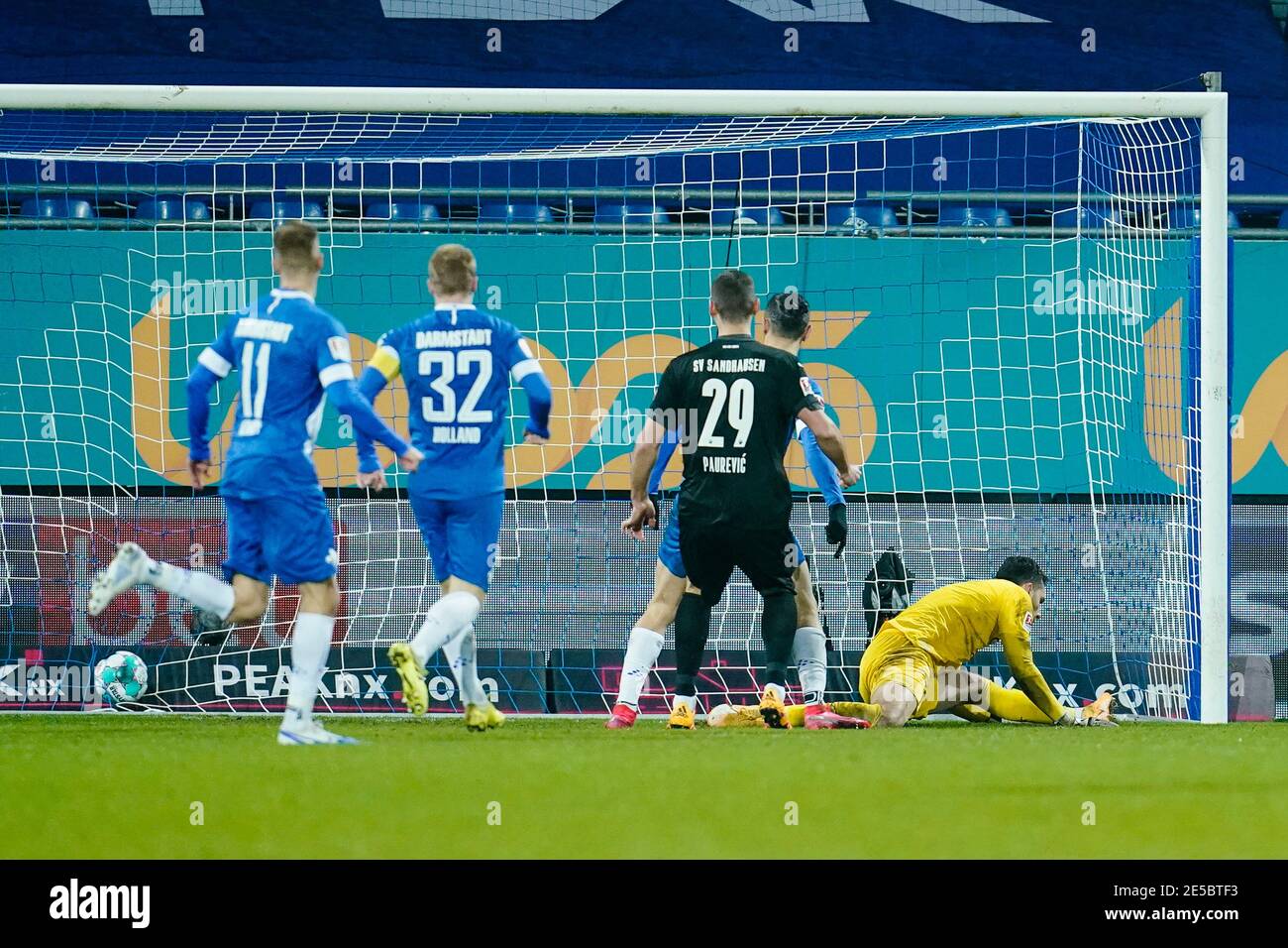 Darmstadt, Germany. 27th Jan, 2021. Football: 2. Bundesliga, SV Darmstadt 98 - SV Sandhausen, Matchday 18, Merck-Stadion am Böllenfalltor. Sandhausen goalkeeper Stefanos Kapino is unable to keep out Darmstadt's Marvin Mehlem's (not in picture) shot on goal to make it 2:1. Credit: Uwe Anspach/dpa - IMPORTANT NOTE: In accordance with the regulations of the DFL Deutsche Fußball Liga and/or the DFB Deutscher Fußball-Bund, it is prohibited to use or have used photographs taken in the stadium and/or of the match in the form of sequence pictures and/or video-like photo series./dpa/Alamy Live News Stock Photo