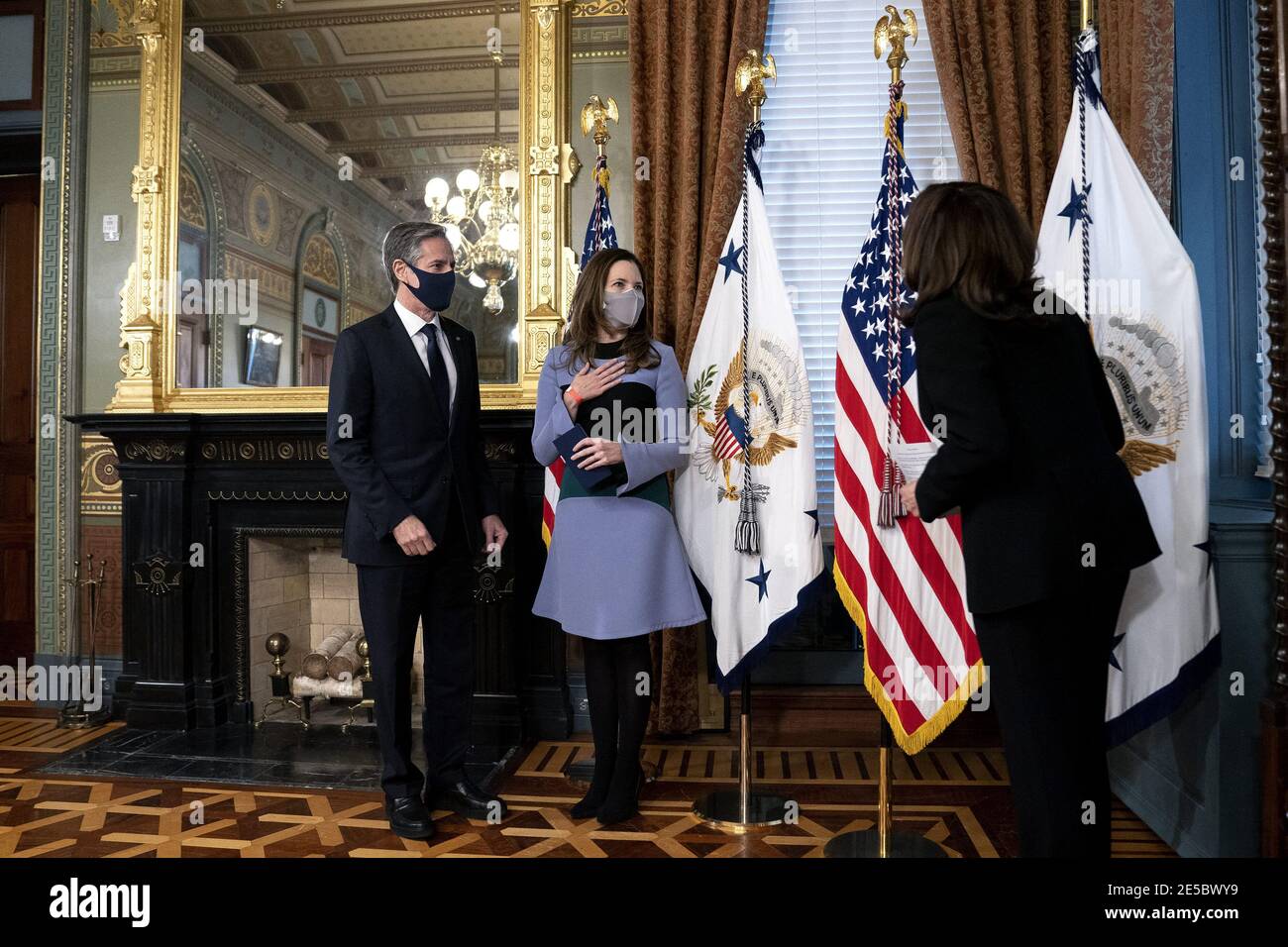 U.S. Vice President Kamala Harris, right, speaks to Antony Blinken, U.S. secretary of state, left, and his wife Evan Ryan during a swearing in ceremony at the White House in Washington, D.C., U.S., on Wednesday, Jan. 27, 2021. The Senate yesterday confirmed Blinken, giving one of President Biden's longest-serving aides the task of resuming nuclear negotiations with Iran and restoring trust with allies shaken by four years of the Trump administration. Photo by Stefani Reynolds/Pool/ABACAPRESS.COM Stock Photo
