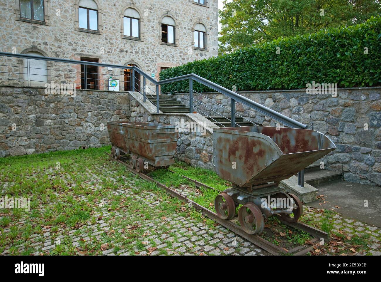 Old rusty mine wagons outside the Mining Museum of Abbadia San Salvatore, Tuscany, Italy Stock Photo
