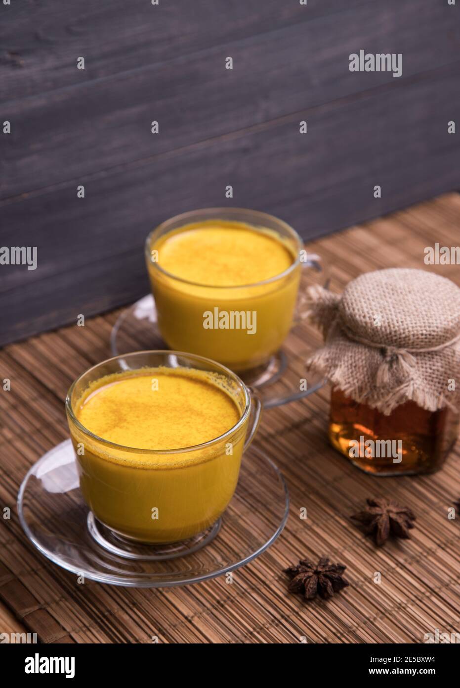 Two glass cups with a trendy Asian detox drink made from almond milk