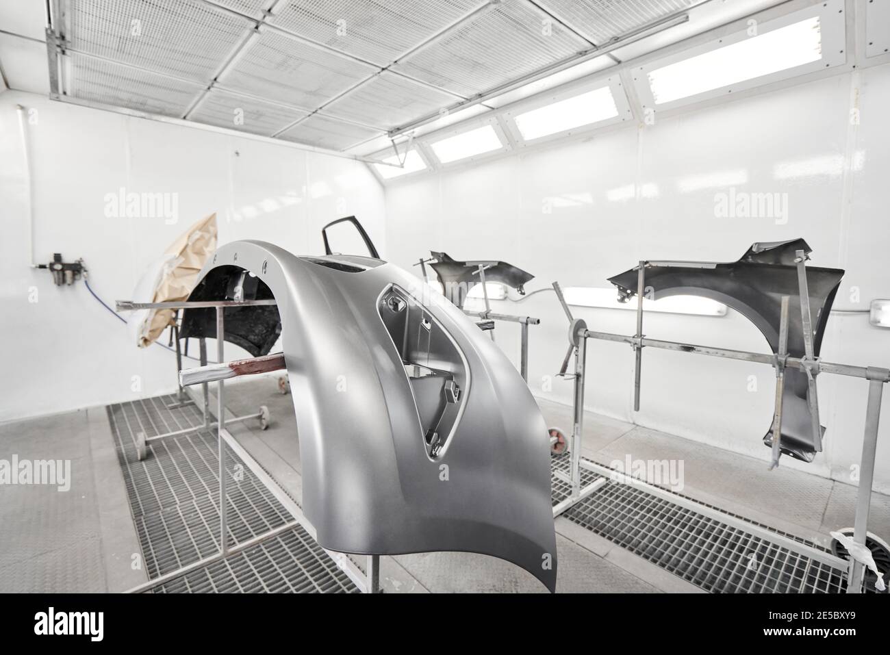 New bumper for painting. Repairing car body work after the accident by