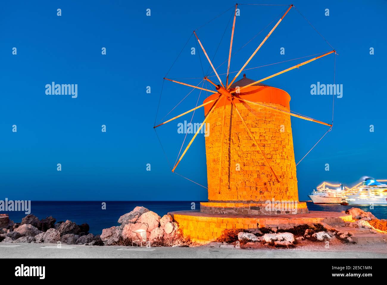 Rhodes, Greece. Stunning night image of Mandraki old harbour windmills in Dodecanese Islands. Stock Photo