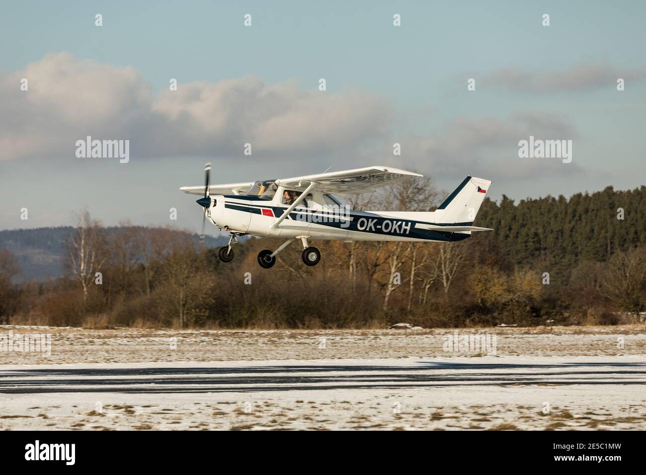 DLOUHA LHOTA, CZECH REP - JAN 27, 2021. Small sport airplane Cessna 150 on a background of blue sky. Stock Photo