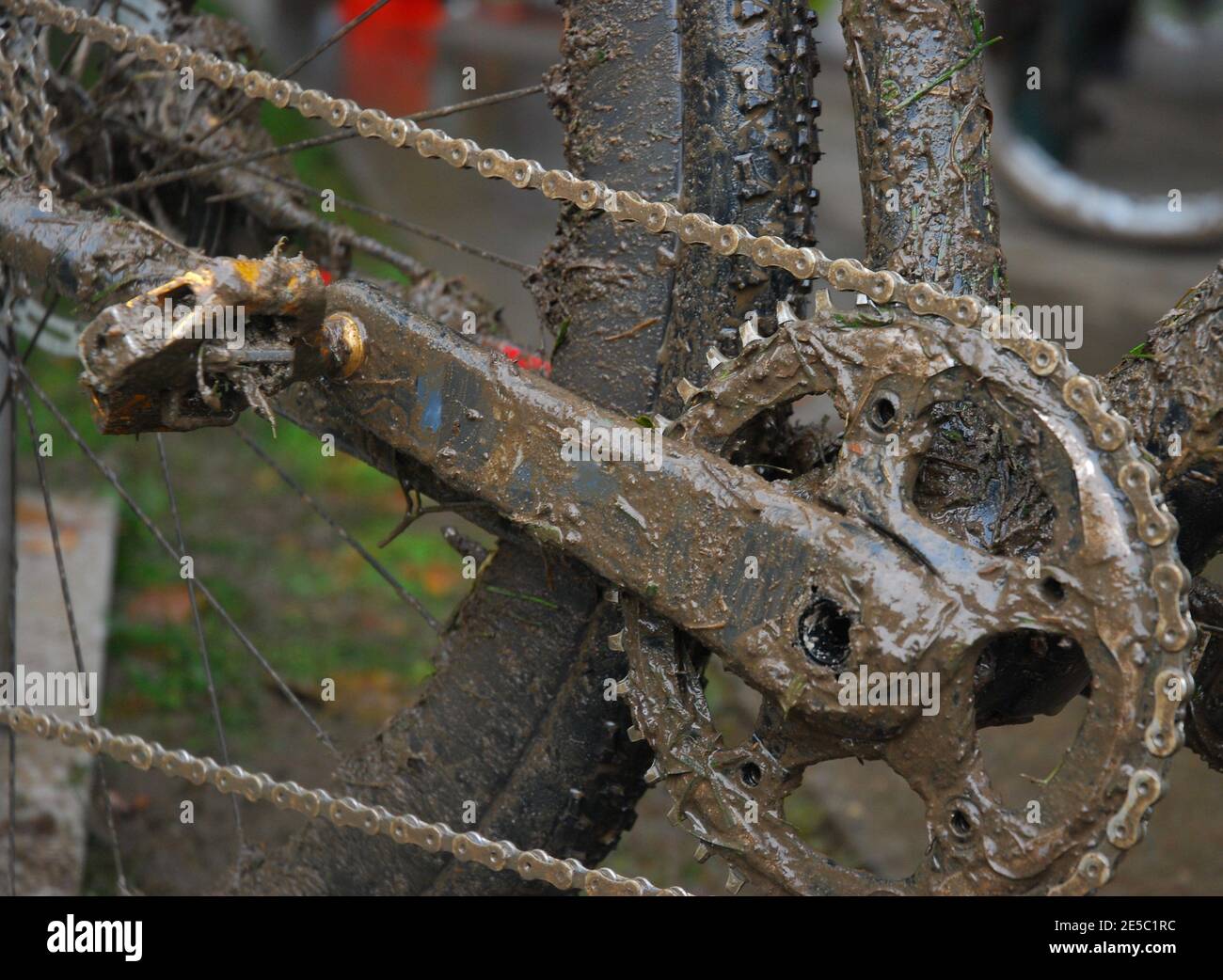Bicycle drive train covered in mud and grass Stock Photo Alamy