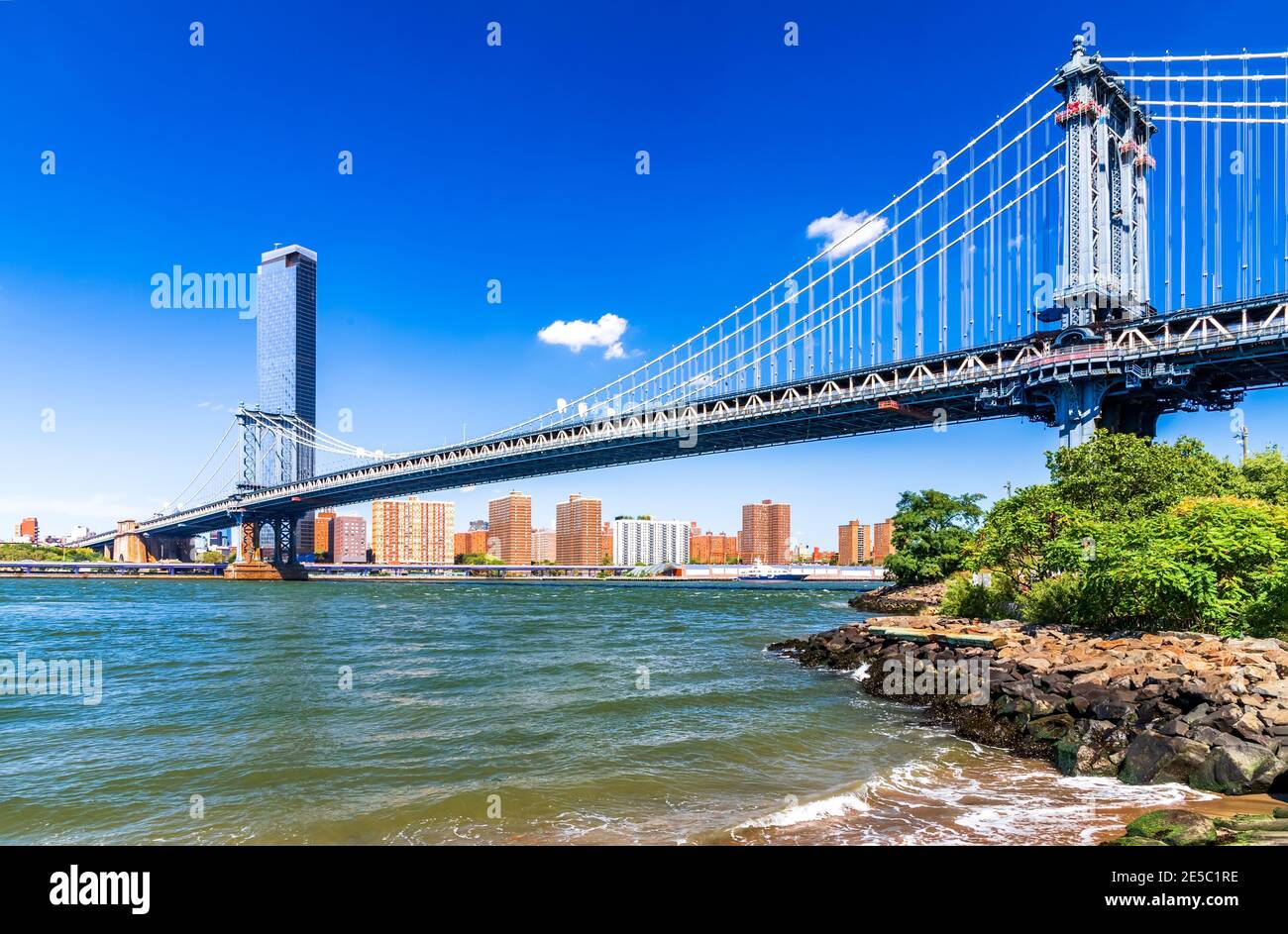 New York, United States of America. Manhattan Bridge over East River and Lower East Side skyline of New York City. Stock Photo