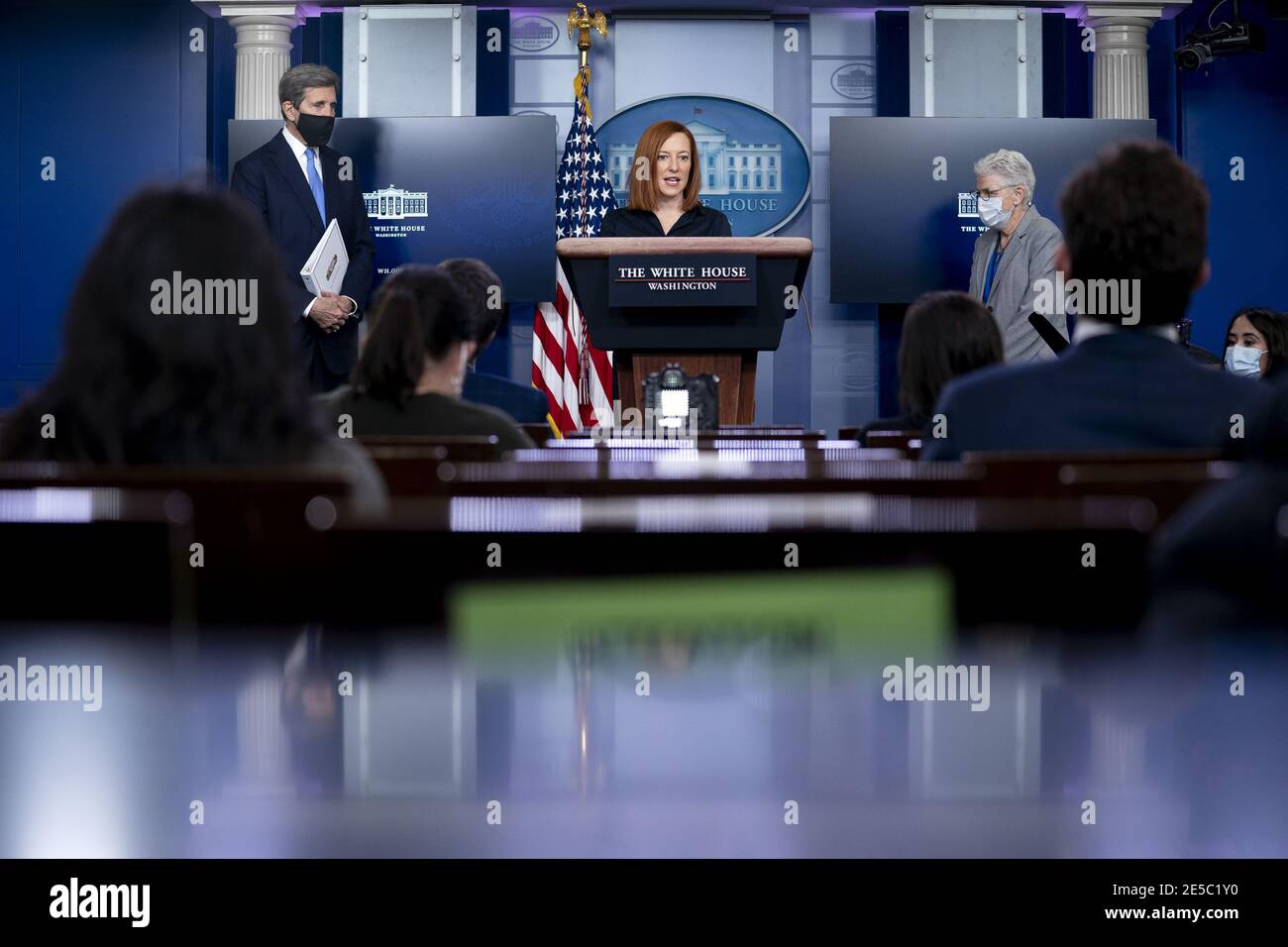 Washington, United States. 27th Jan, 2021. Jen Psaki, White House press secretary, speaks alongside John Kerry, Special Presidential Envoy for Climate, left, and Gina McCarthy, National Climate Advisor, right, during a news conference in the James S. Brady Press Briefing Room at the White House in Washington, DC, U.S., on Wednesday, Jan. 27, 2021. U.S. President Joe Biden will take executive action on Wednesday to combat climate change, including temporarily blocking new leases for oil drilling on federal lands, ordering a review of fossil-fuel subsidies and other measures to overhaul the U.S. Stock Photo