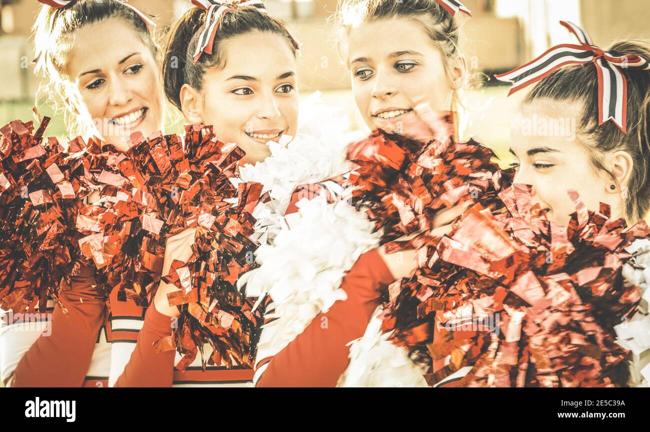 Group of cheerleaders at university sport event show - Concept of unity and team sport with active girls - Training at college high school Stock Photo