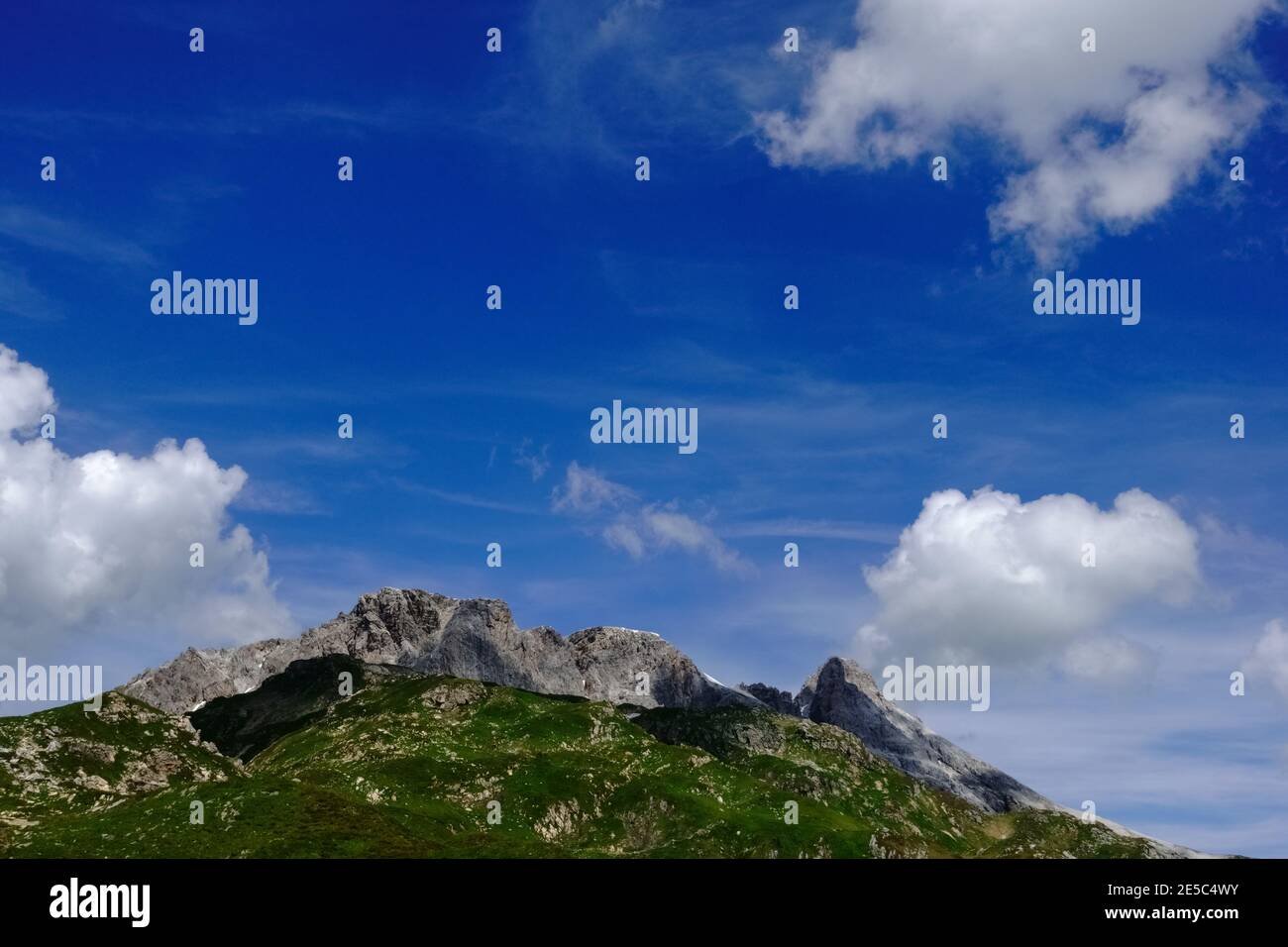 gorgeous mountains with a blue sky and clouds in the summer Stock Photo ...