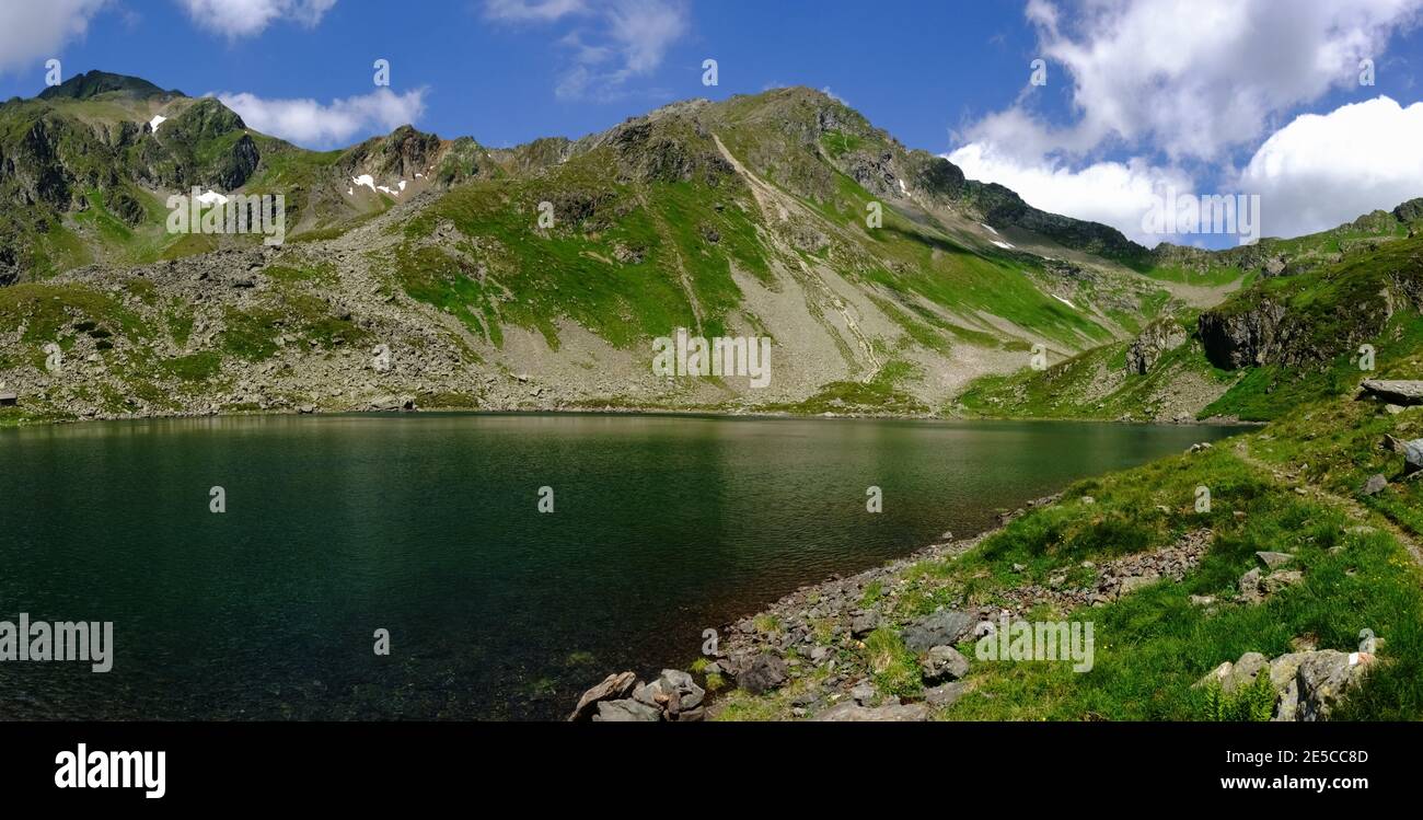 wonderful panorama from a mountain lake and mountains in the summer on vacation Stock Photo