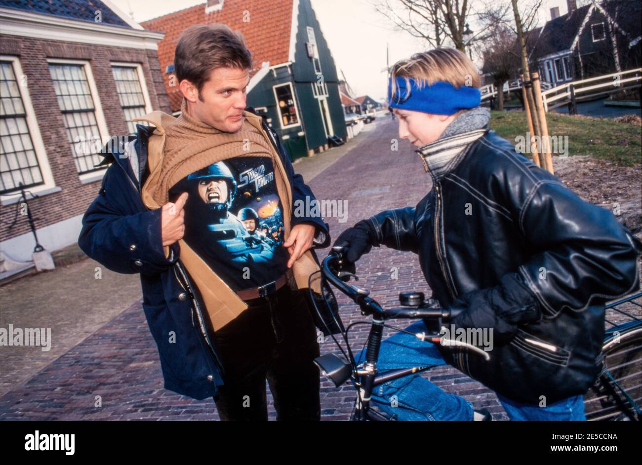 ZAANSE SCHANS, THE NETHERLANDS, DEC 19, 1997: Actor Casper van Dien on ice in the Netherlands in front of a mill during a promotion tour of the movie Stock Photo