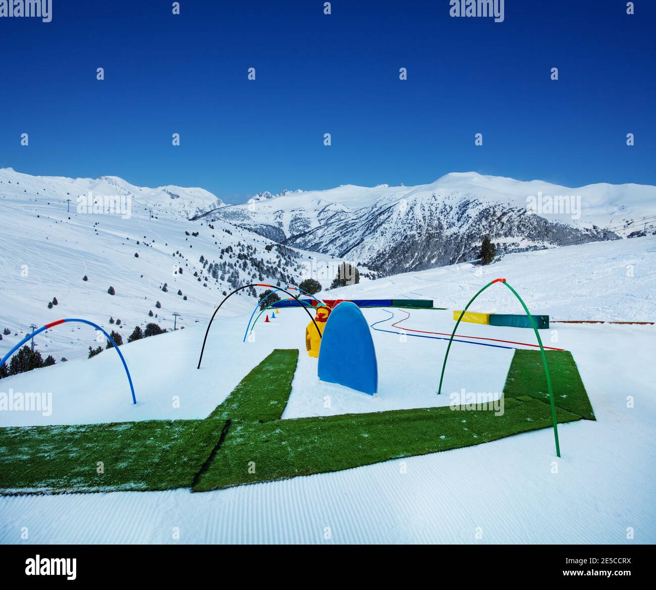 Slope and equipment for small children in infant ski school the mountain in skiing center Stock Photo