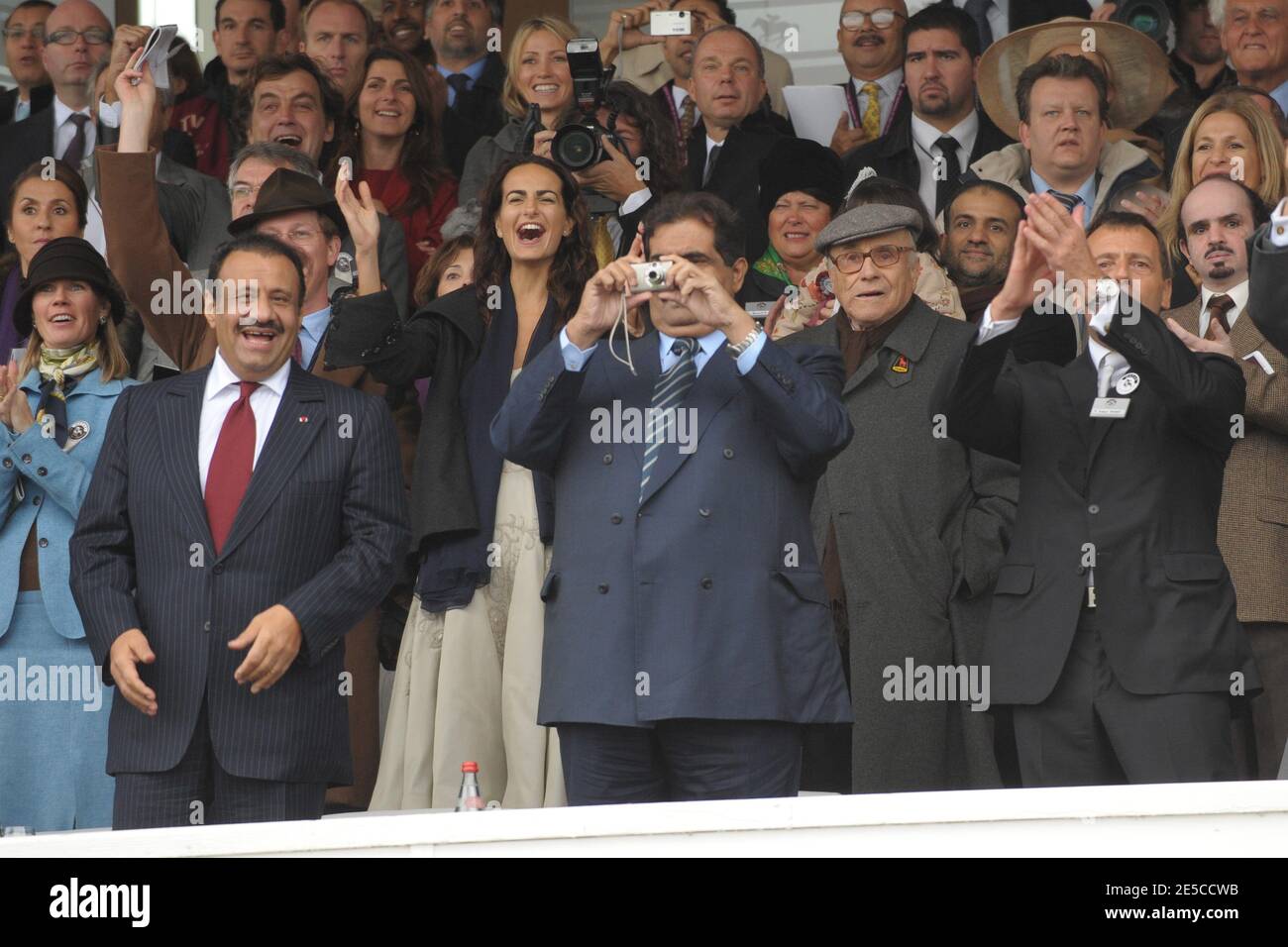 Qatar's Emir Sheikh Hamad Bin Khalifa Al Thani takes a photo as he is next to Saudi Vice Minister of Defence Prince Khaled Bin Sultan Al Saud, at the 87th Arc de Triomphe horserace, one of the world's richest races, at Longchamp Racecourse, near Paris, France, on October 5, 2008. The race, that was sponsored by Qatar for the first time, was won by Aga Khan's horse Zarkava. Photo by Ammar Abd Rabbo/ABACAPRESS.COM Stock Photo