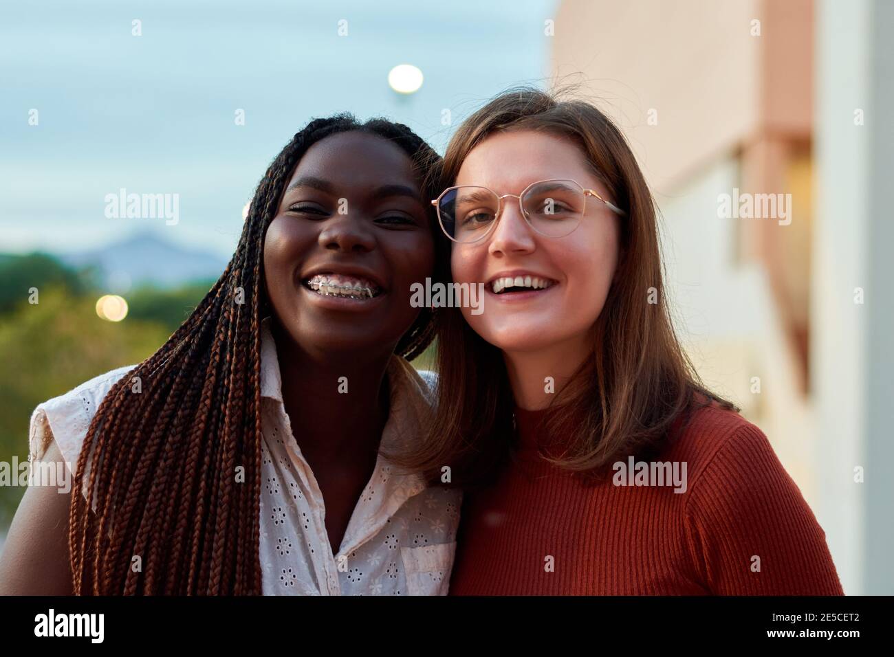 Two students are smiling and looking at camera. Multiethnic concept Stock Photo