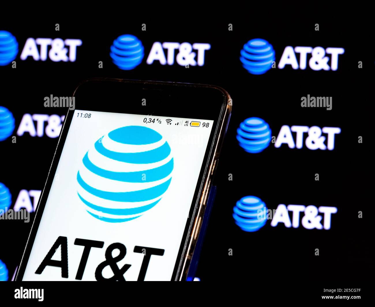 In this photo illustration a AT&T logo seen displayed on a smartphone ...