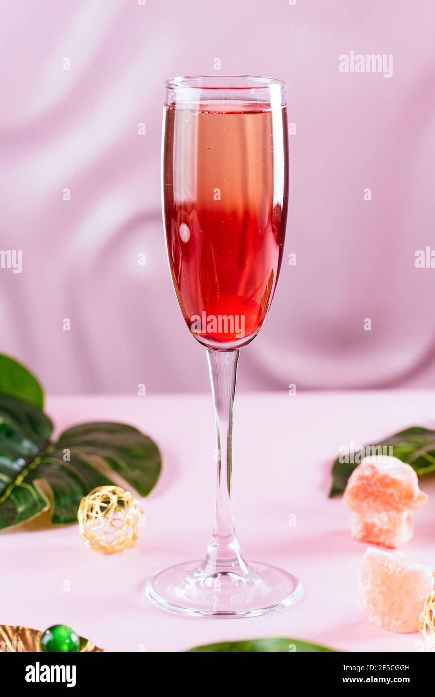 Toast with champagne against illuminations background. Stock Photo