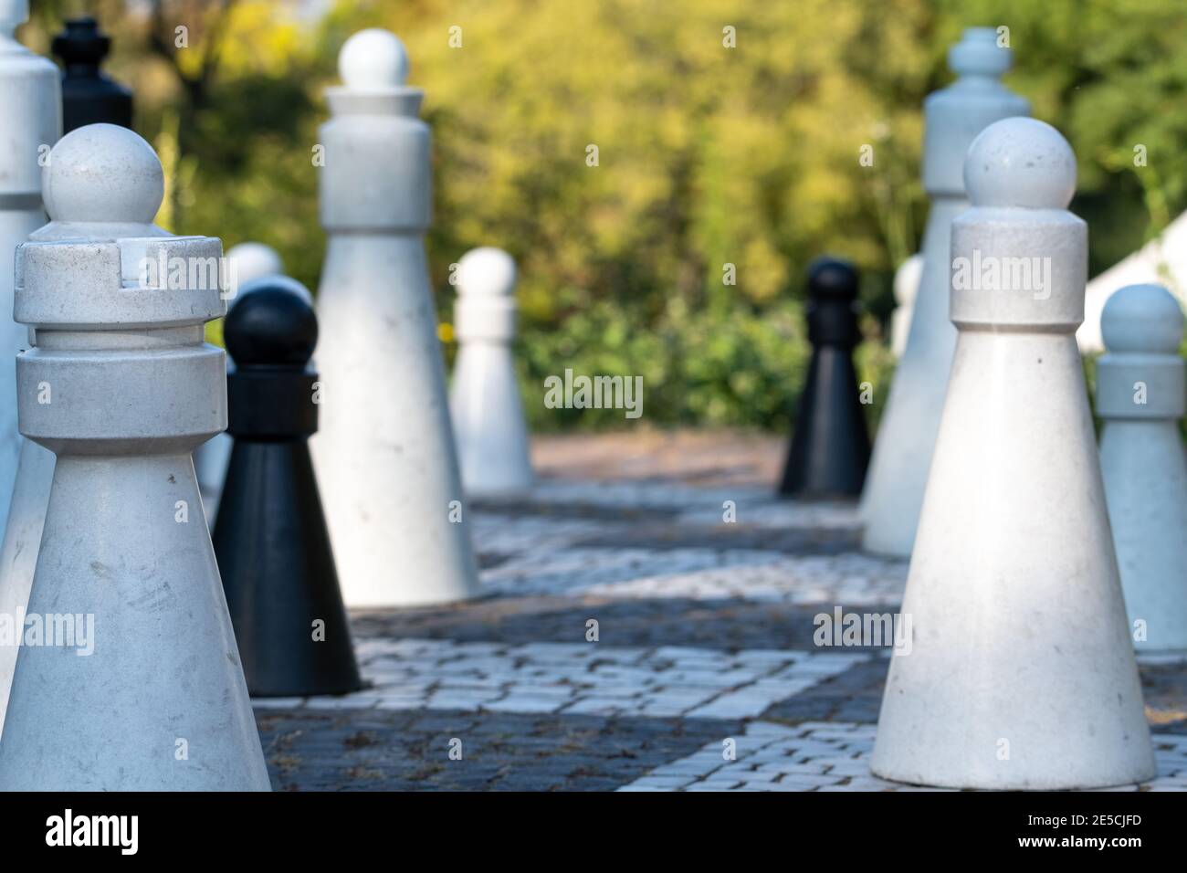 Group of Life-Sized Pawns with the focus being on the front row Stock Photo