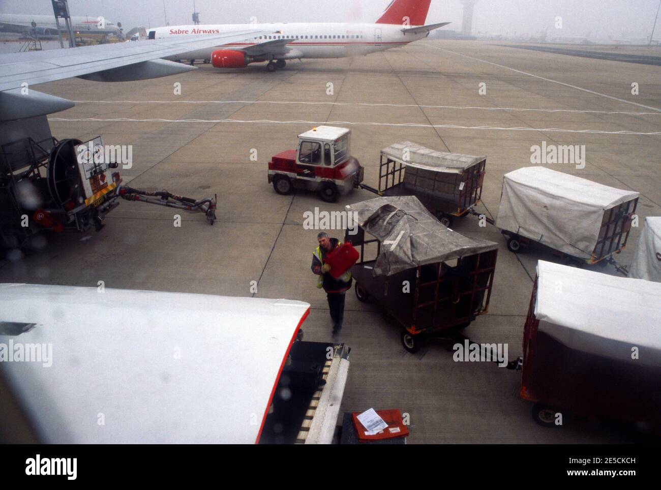 Gatwick Airport Luggage Being Loaded Onto Aeroplane Stock Photo