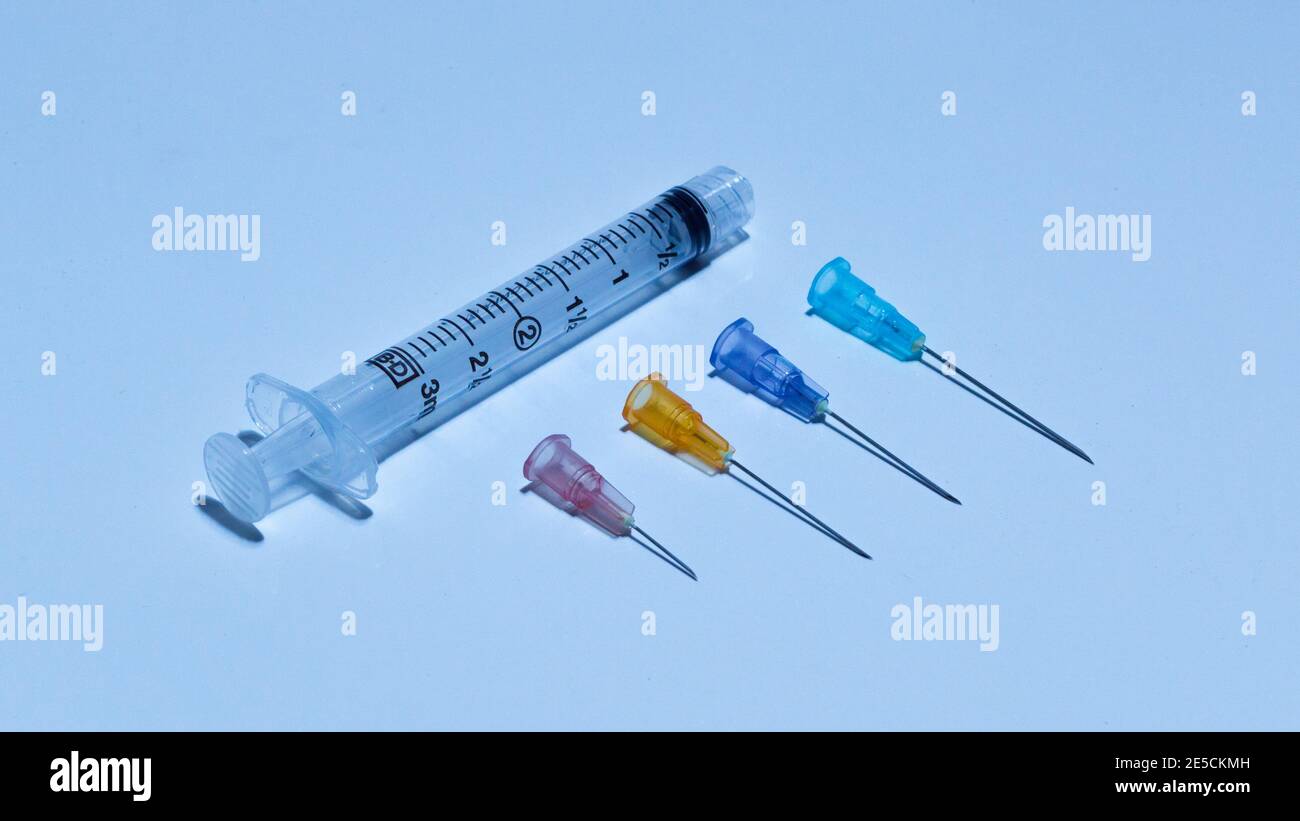Syringe, A medical device that is used to inject fluid into or withdraw fluid from, the body. A medical syringe consists of a needle Stock Photo