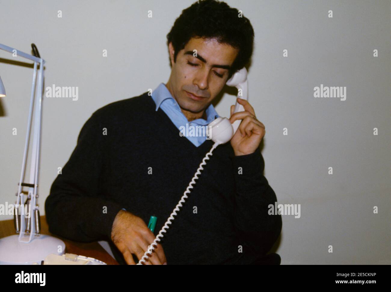 Egyptian Man using Telephone Stock Photo