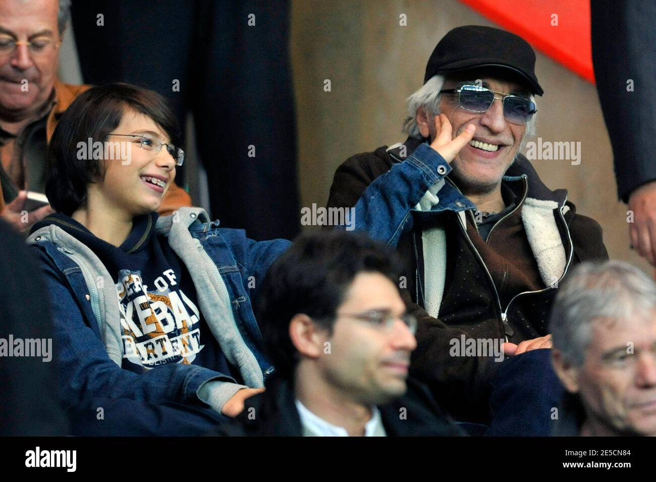 Please hide child face prior to the publication Gerard Darmon with his son attending the French First league soccer match, Paris Saint-Germain vs FC Lorient, at the Parc des Princes in Paris, France on October 18, 2008. (Paris won 3-2). Photo by Stephane Reix/ABACAPRESS.COM Stock Photo