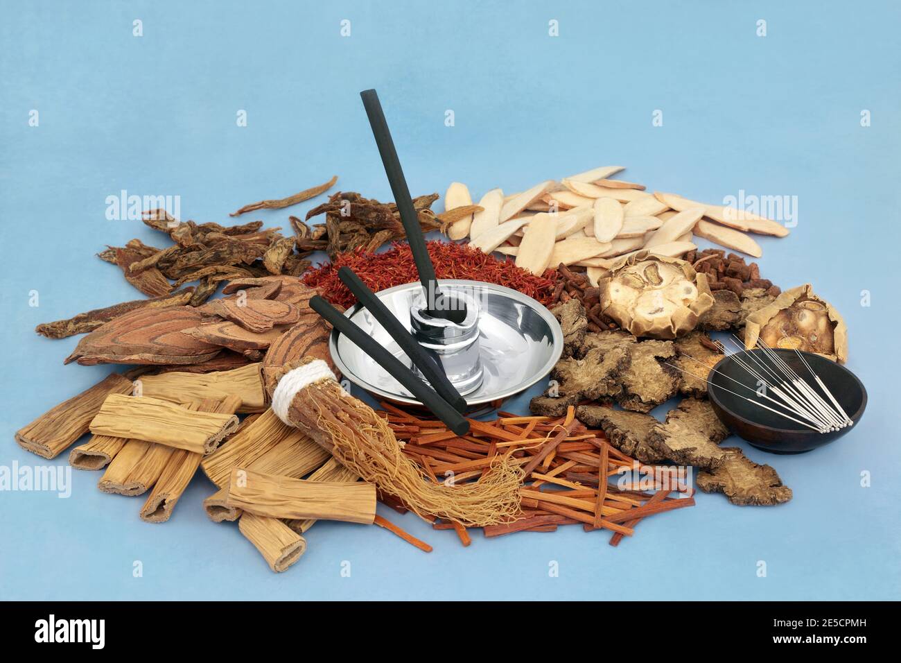 Chinese acupuncture needles & moxa sticks used in moxibustion treatment with herbs & spice used