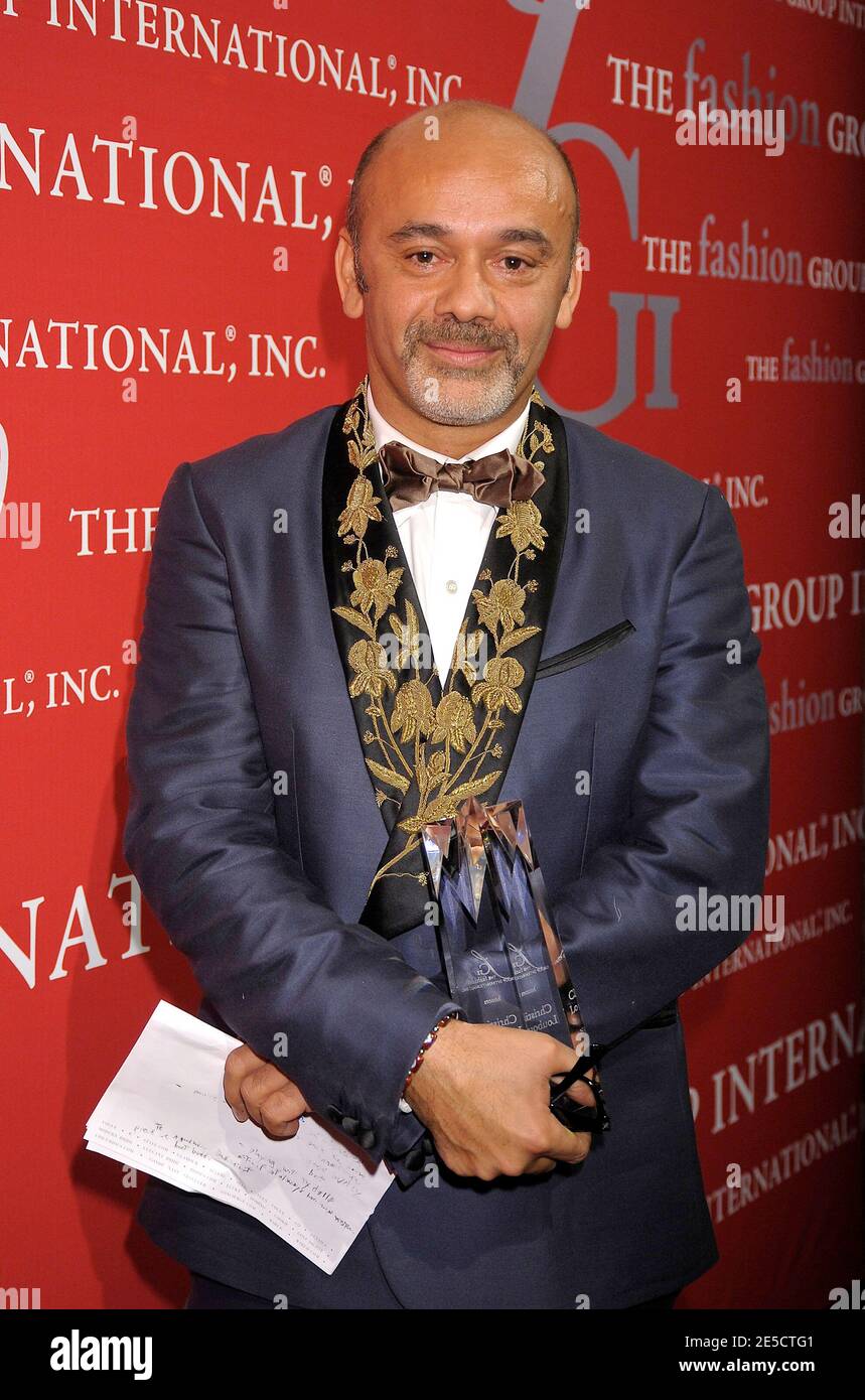 French shoe designer Christian Louboutin poses with his award at the  Fashion Group International presents the 25th Annual Night of Stars  honoring the 'Alchemists' held at in Cipriani Wall Street New York