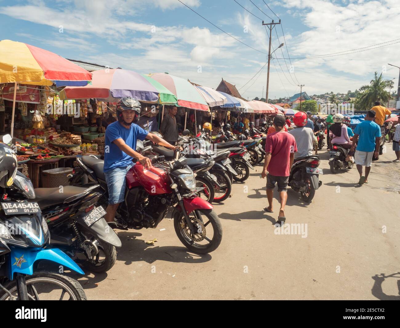 Ambon., Indonesia - Feb, 2018: Crowd of the local people selling and buying different goods on the market, Island of Ambon, Maluku, Indonesia. Asia Stock Photo