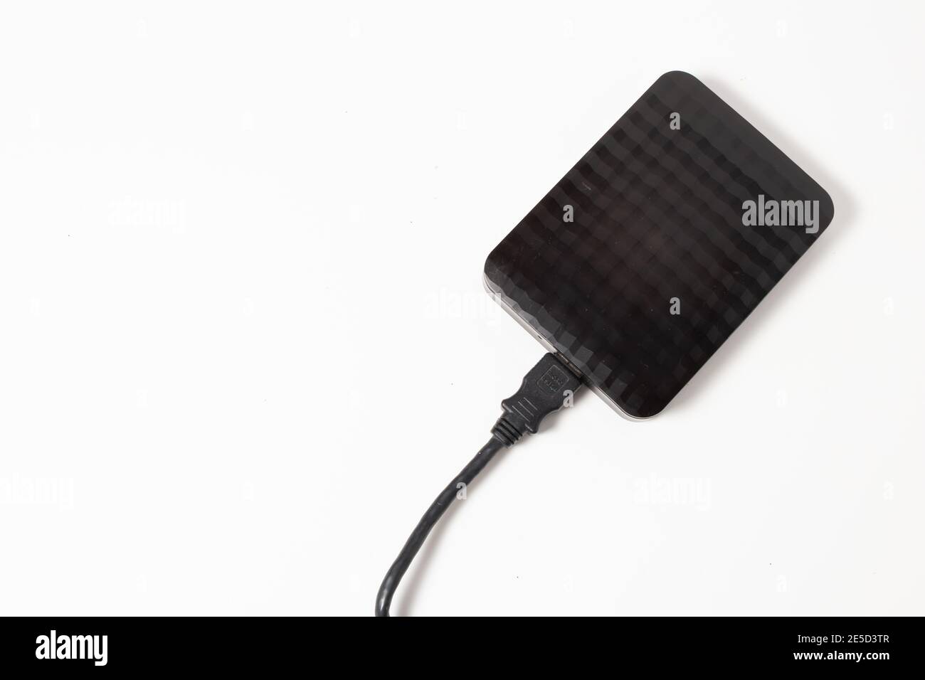 External hard drive or hard disk with USB cable on white background ...