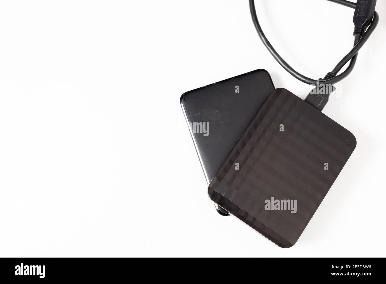 External hard drive or hard disk with USB cable on white background ...