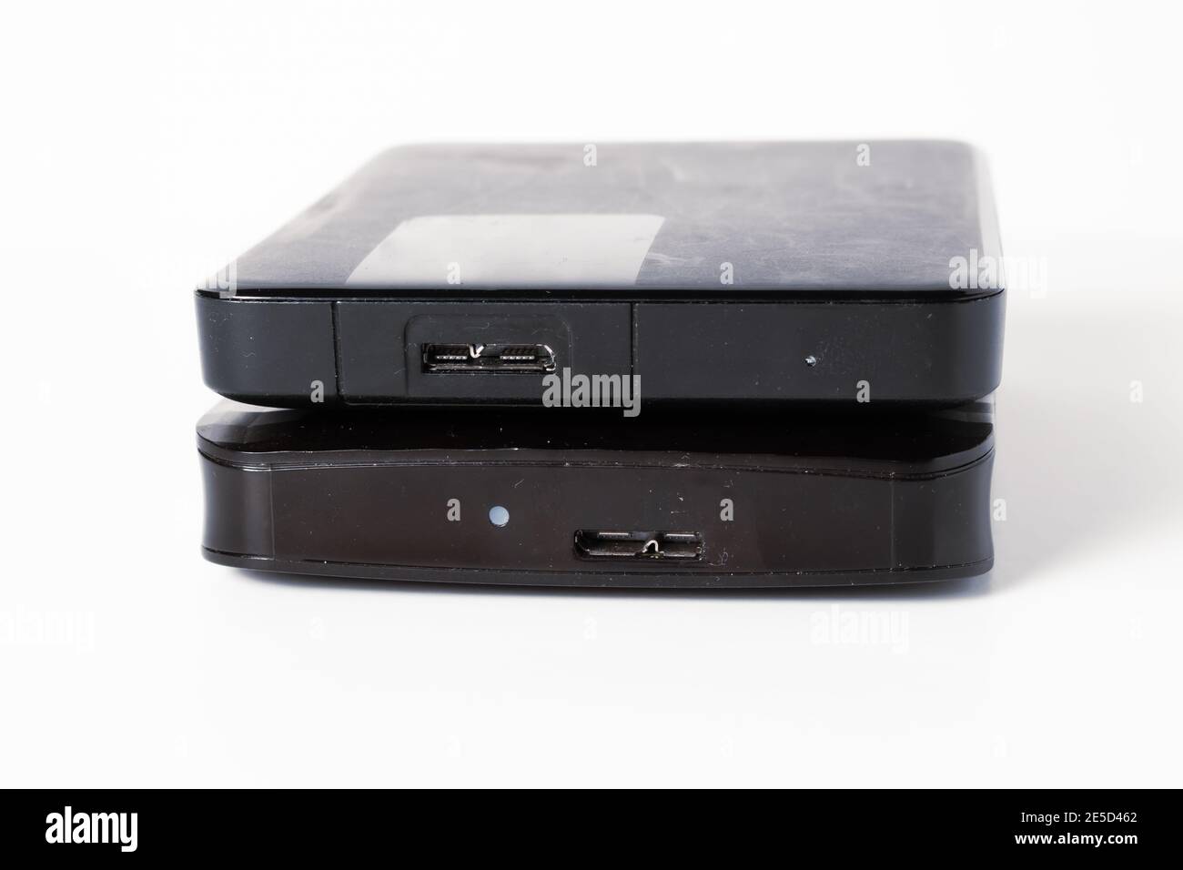 External hard drive or hard disk with USB cable on white background ...