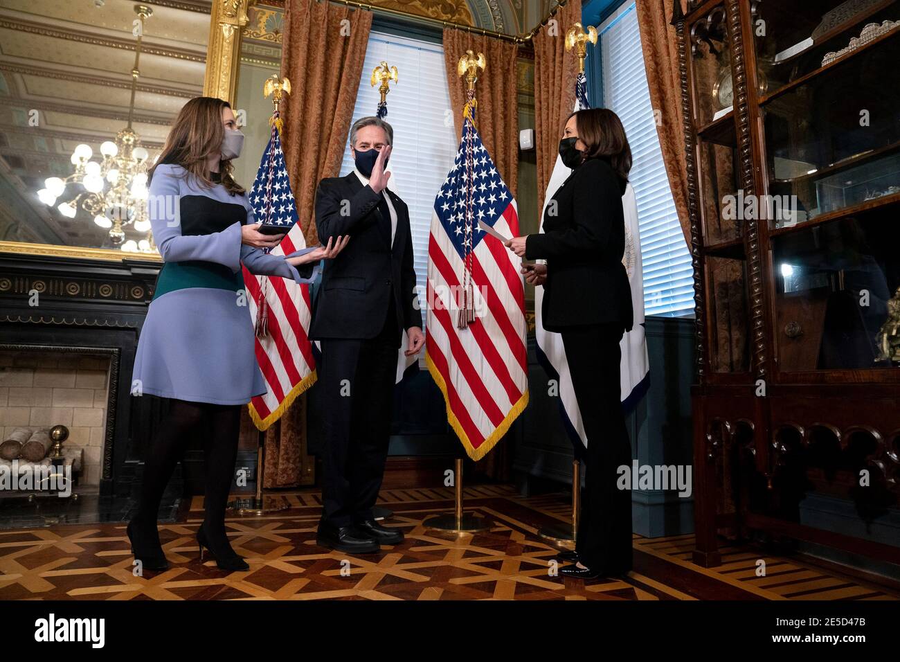 U.S. Vice President Kamala Harris, right, swears in Antony Blinken, U.S. secretary of state, center, during a ceremony at the White House in Washington, DC, U.S., on Wednesday, Jan. 27, 2021. The Senate yesterday confirmed Blinken, giving one of President Biden's longest-serving aides the task of resuming nuclear negotiations with Iran and restoring trust with allies shaken by four years of the Trump administration. At left is Blinken's wife, Evan Ryan, who serves as President Biden's cabinet secretaryCredit: Stefani Reynolds/Pool via CNP | usage worldwide Stock Photo
