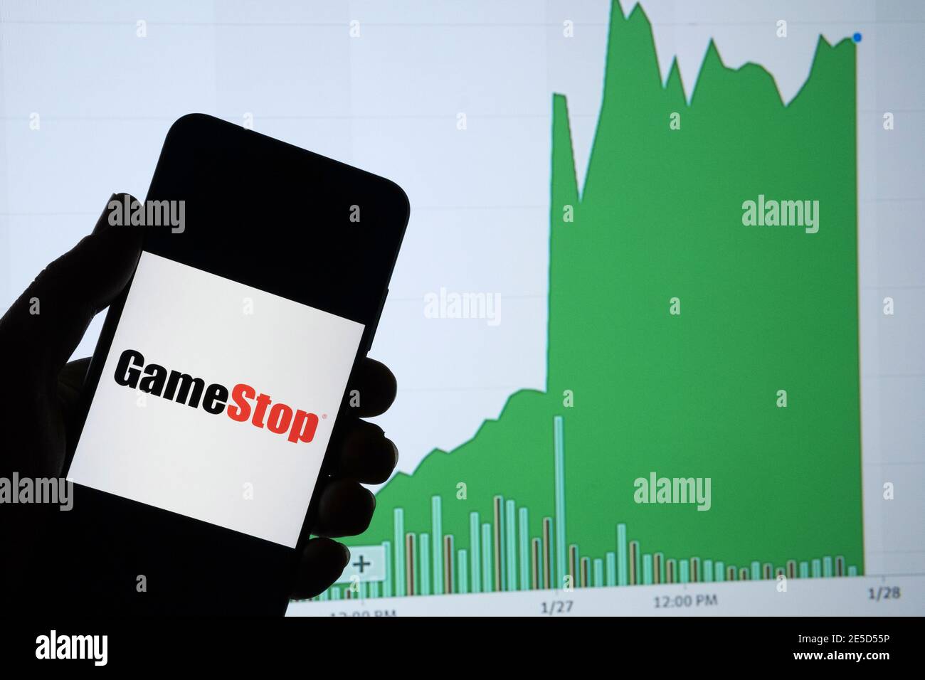 Gamestop retail company logo on the smartphone and its authentic stock