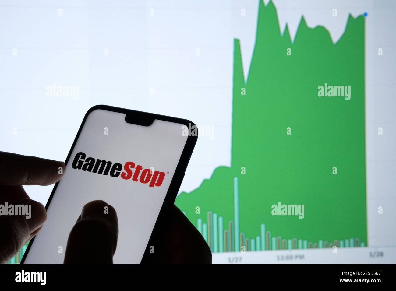 Gamestop retail company logo on the smartphone and its authentic stock