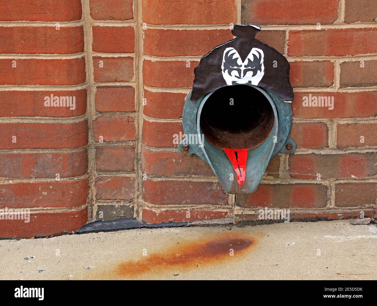 Downspout fashioned into the likeness of Gene Simmons of the rock group KISS. Stock Photo