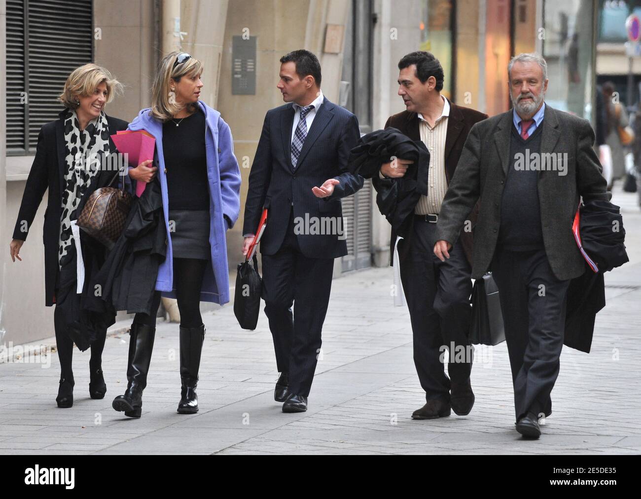 Former French trader Jerome Kerviel (C) of the French bank Societe Generale  (SG) arrives with his lawyers Caroline Wassermann (2nd L), Bernard Benaiem  (2nd R) and Francis Tissot (R) for a hearing