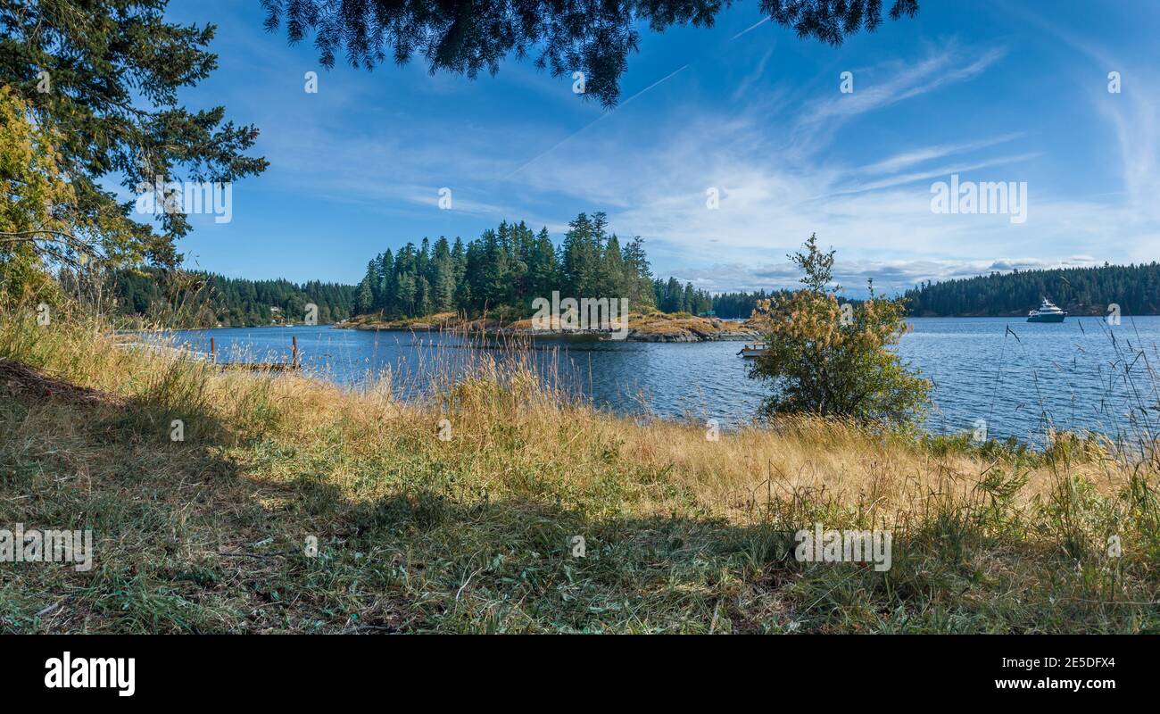 Coastal landscape with ferry sailing in the distance, British Columbia, Canada Stock Photo