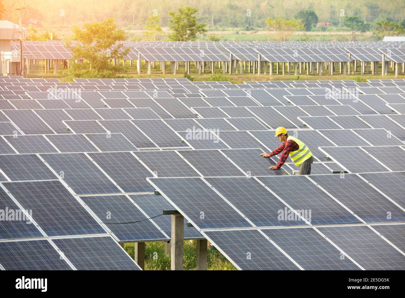 Portrait of an engineer working on solar panels on a solar farm, Thailand Stock Photo