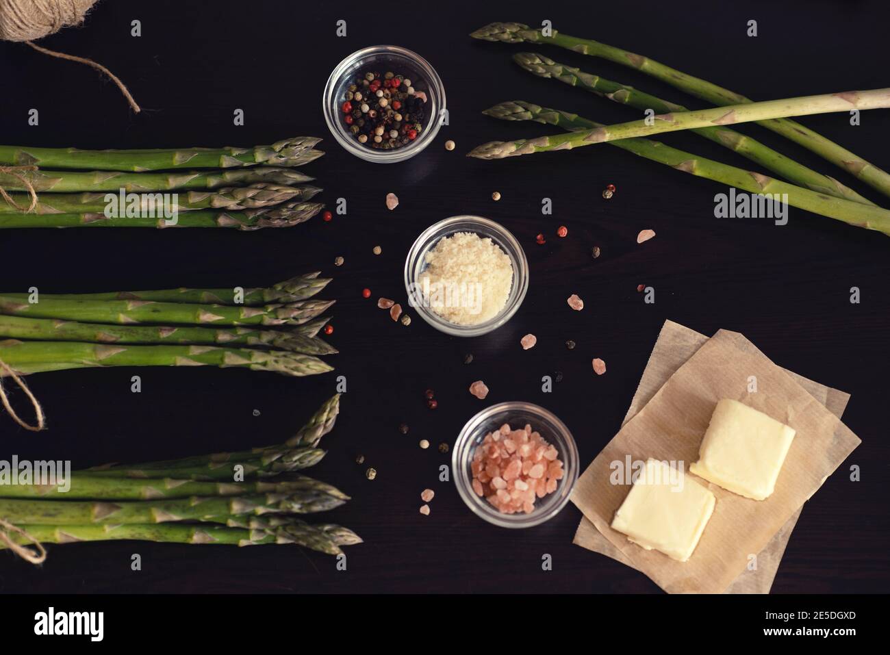 Overhead view of asparagus, butter, parmesan cheese, salt and pepper Stock Photo