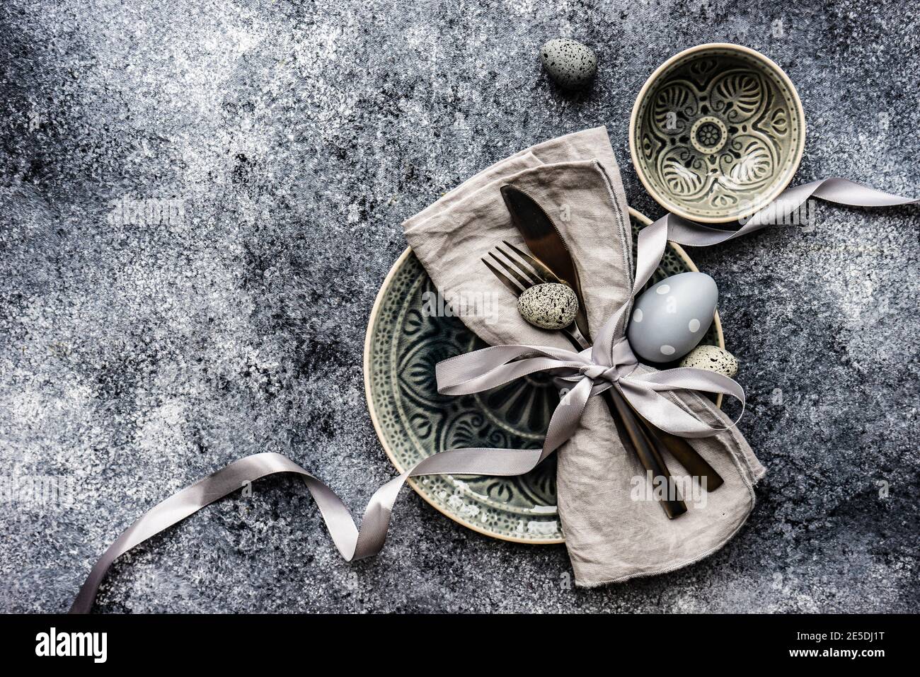Easter place setting with painted Easter egg decorations Stock Photo