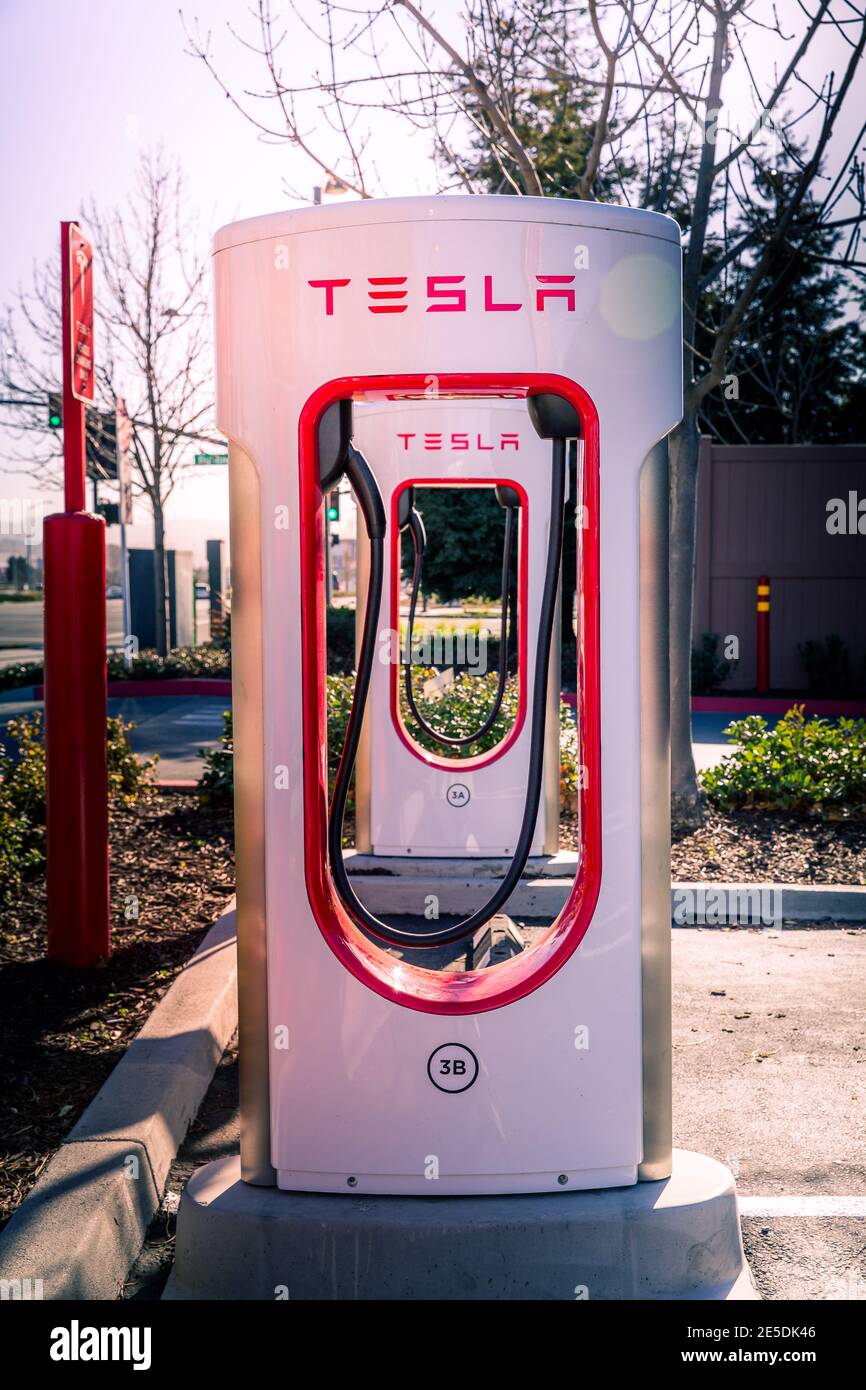 Fremont, CA, USA - January 20, 2021: Tesla Supercharger for electric cars. Tesla is  an American electric vehicle and clean energy company based in Pa Stock Photo