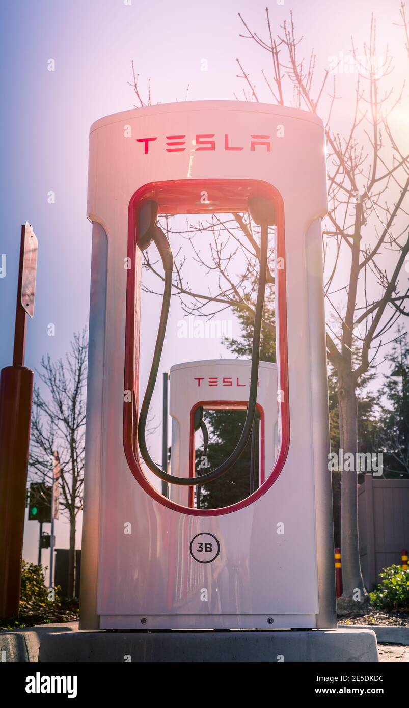 Fremont, CA, USA - January 20, 2021: Tesla Supercharger for electric cars. Tesla is  an American electric vehicle and clean energy company based in Pa Stock Photo